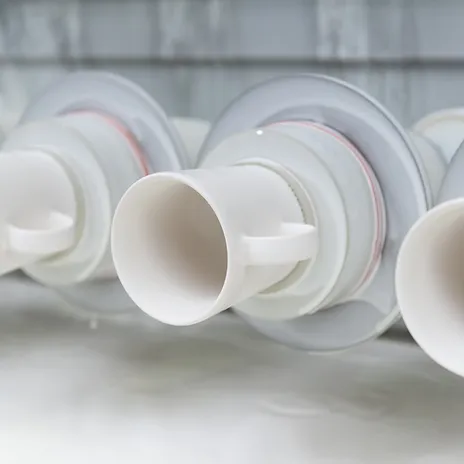 Automated ceramic glaze application line for commercial tableware