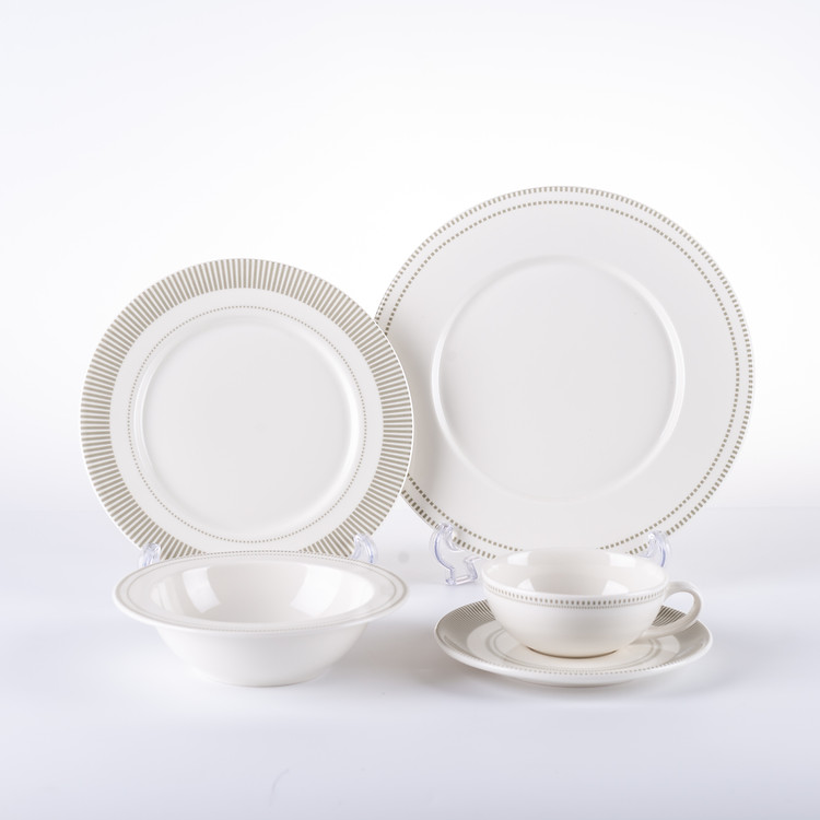Crown Ceramics master technician inspecting precision molded tableware